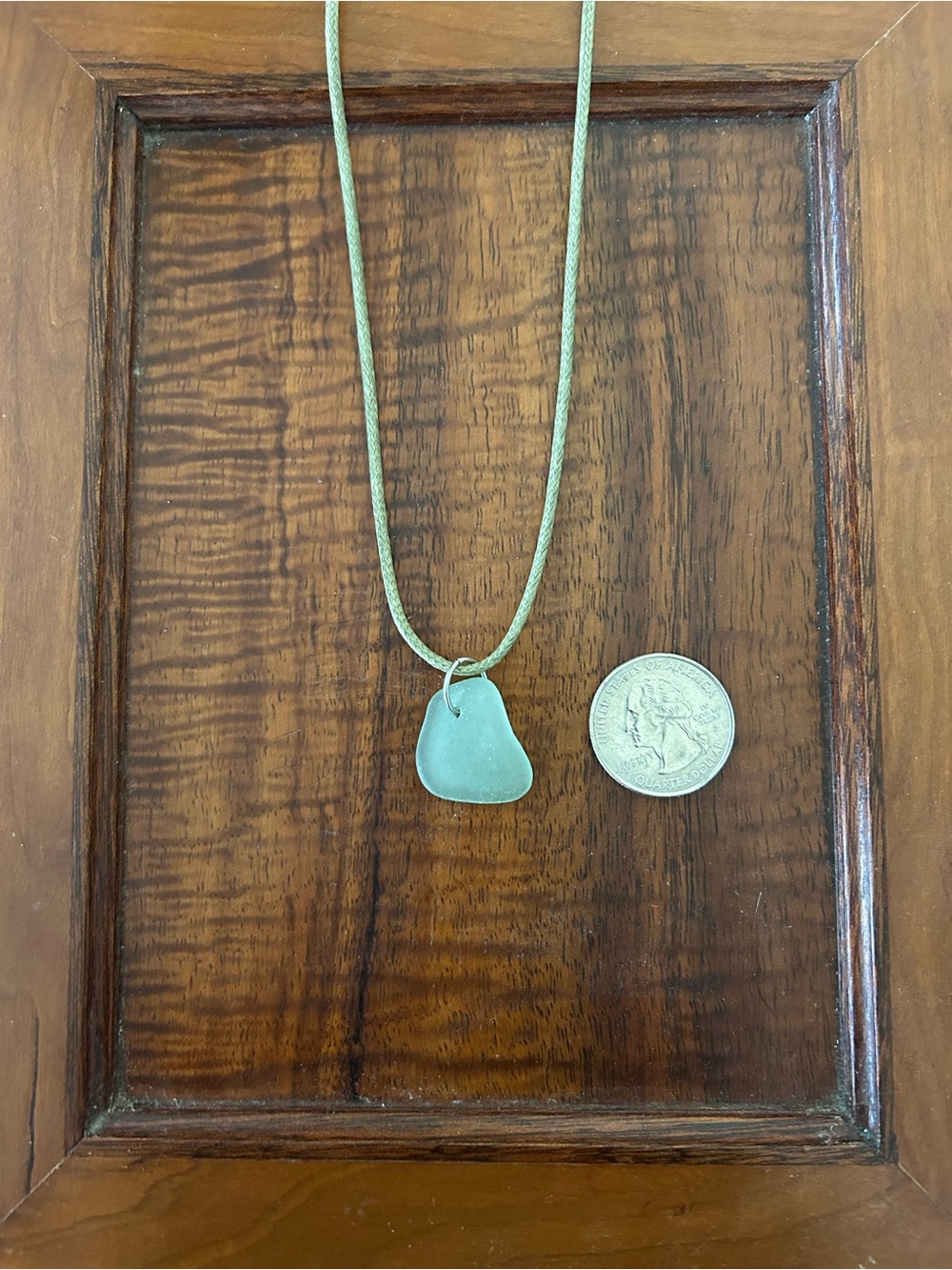 Light green sea glass pendant on 18-inch green cord